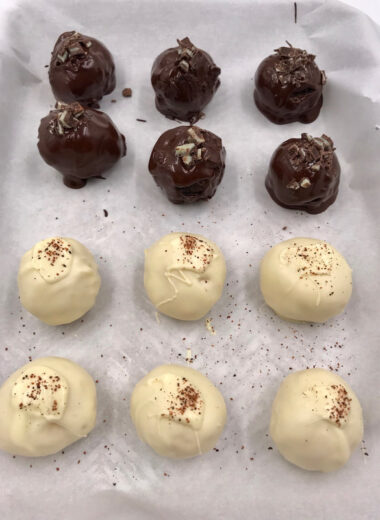 Chocolate and Vanilla Truffles on a plate.